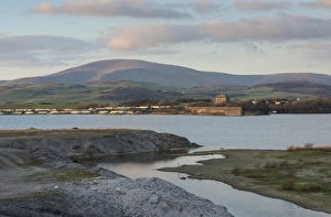Flood Prints: View of flooded former iron ore mining area, surrounded by sea wall on outskirts of Millom