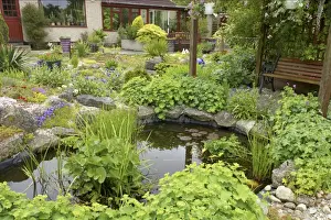 Seats Prints: View of garden with pond, pergola, benches and house in background, Essex, England
