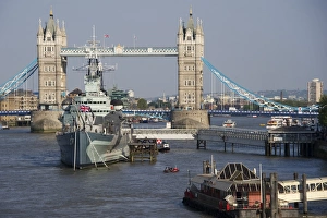 Ship Prints: View of HMS Belfast museum ship moored on river in city