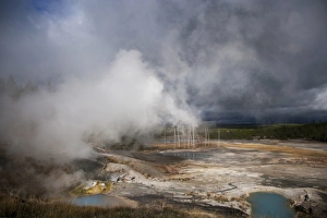 Storm Prints: View of hotsprings with steam and approaching stormclouds