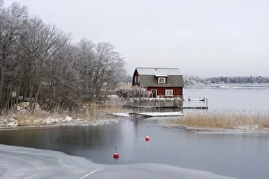 Cottages Prints: View of house and frozen lake, Fogdo