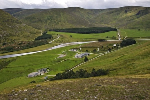 Flowing Prints: View of houses and river in valley