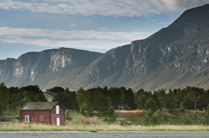 Fiord Prints: View of hut on shore of fjord, Skibotn