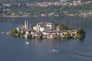 Buildings Prints: View of lake island and water taxis, Isola San Giulio, Lake Orta, Piedmont, Italy, May