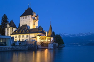Historic Prints: View of lakeside castle illuminated at night
