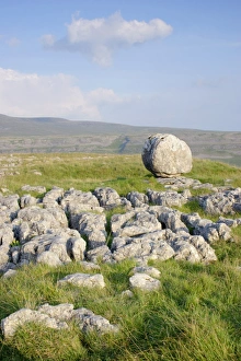 View of limestone pavement and erratic rock, Twistleton Scars, looking towards Ingleborough, Ribblesdale
