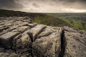 Rugged Prints: View of limestone pavement in upland landscape at sunset