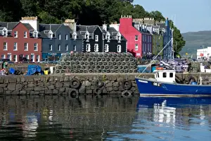 Seafronts Prints: View of lobster pots and fishing boat at harbour of coastal town
