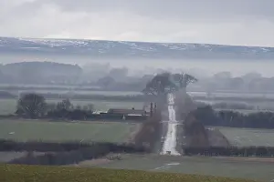 Moor Land Prints: View of mist over fields and rural lane