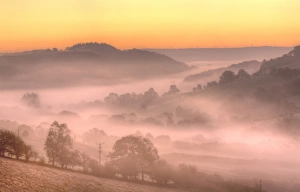 Sun Rise Prints: View of mist and frost in valley at sunrise