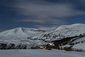 Moorland Prints: View of moonlit snow covered upland farmland and fells at night