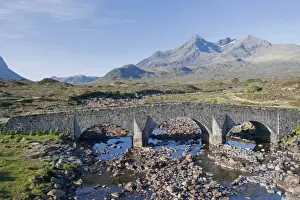View of moorland river with old Sligachan Bridge and mountains, Sgurr nan Gillean, Cuillin Mountains, Glen Sligachan