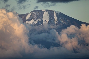 Peak Prints: View of mountain summit with clouds at sunset