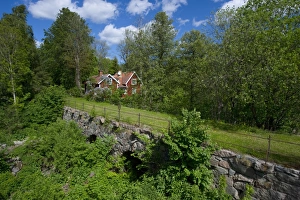 Cottages Prints: View of old stone bridge and red house, Gryttjom, Uppsala, Sweden, may