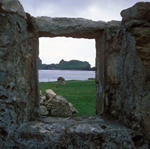 Window Prints: View through old window frame of derelict cottage