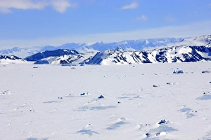 Antarctic Prints: View of pack ice and snow covered mountains