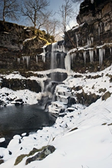 View of partially frozen waterfall with icicles, Uldale Force, River Rawthey, Baugh Fell, Howgill Fells, Cumbria