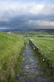 Moorland Prints: View of path and gate leading from 13th century church on moorland at sunrise