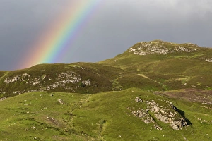 View of rainbow over mountains, near Dornie, Ross and Cromarty, Highlands, Scotland, July