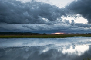 Northern Europe Prints: View of rainclouds over lake habitat at sunset, Muonio, Lapland, Finland, September