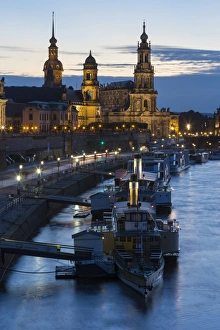 Central Europe Prints: View of river with boats in city at night