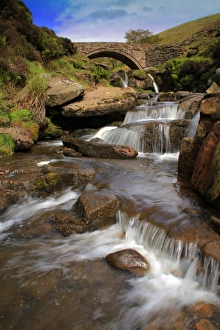 Meet Prints: View of river cascades and packhorse bridge