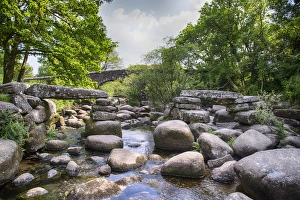 Boulders Prints: View of river with partially collapsed clapper bridge