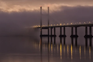 Gloucestershire Prints: View of road bridge over river shrouded in mist at sunrise