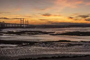 Gloucestershire Prints: View of road bridge over river at sunset