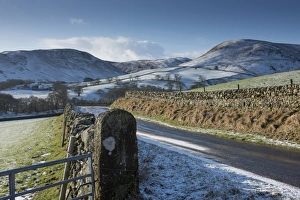 Moorland Prints: View of road, drystone walls and snow covered hills