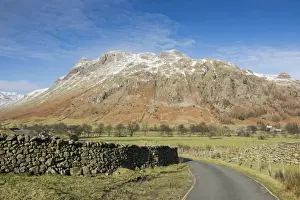 Moorland Prints: View across road, drystone walls and valley pasture towards snow covered fell