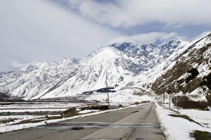 Caucasus Prints: View of road and snow covered mountains