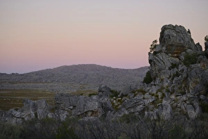 South Africa Prints: View of rock formations in upland habitat at sunset