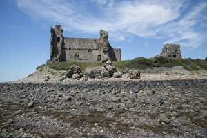 Ruined Prints: View of rocky beach and ruined castle