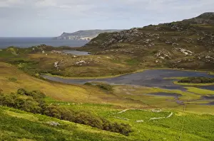 Lochs Prints: View of rocky hillside overlooking freshwater loch and north coast