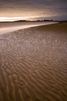 View of sandy beach at sunset, Holkham Bay, Norfolk, England, august