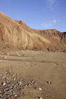 Pebbles Prints: View of sea cliffs and pebbles on beach
