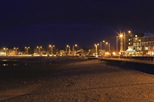 Promenades Prints: View of seaside resort town beach and promenade at night