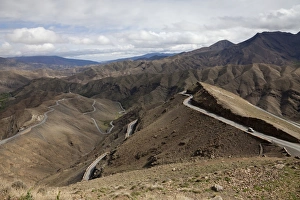 Moroccan Prints: View of serpentine road through mountains, High Atlas, Morocco. may