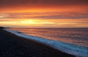 Shingle Prints: View of shingle beach and sea at sunset, Weybourne, Norfolk, England, august