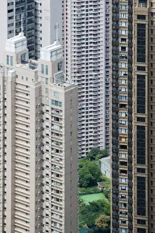 Block Prints: View of small garden and tennis court amongst skyscraper apartment blocks in densely populated area of city