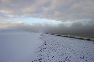 View of snow covered beach, Salthouse, Norfolk, England, december