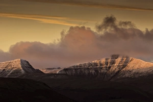 Sunrise Prints: View of snow covered hills at sunrise