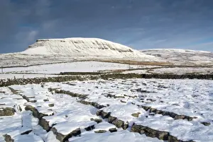 Yorkshire Prints: View of snow covered limestone outcrop and drystone walls