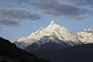 Peak Prints: View of snow covered mountain peak at dawn, Miancimu, Meilixueshan, Yunnan, China, april