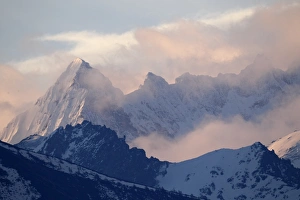 Rugged Prints: View of snow covered mountain peaks at sunrise, Beimaxueshan, Yunnan, China, april
