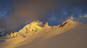 Peak Prints: View of snow covered mountain range at sunset