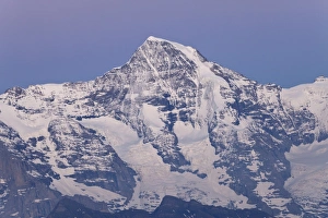 Sun Set Prints: View of snow covered mountain summit at dusk