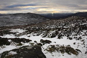 Moor Land Prints: View of snow covered upland habitat with distant sunbeams