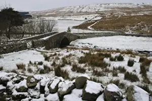 Bridges Prints: View of stream flowing through snow covered fields and under stone bridge